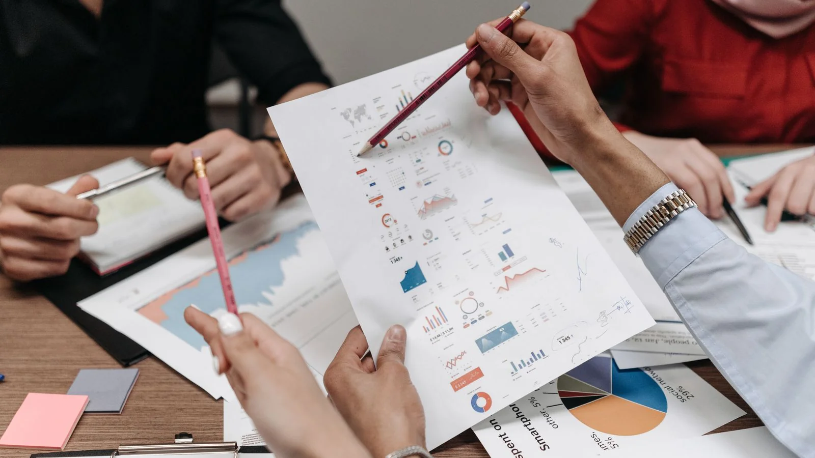 A team analyzing reports together, the kind of scrutiny your methodology has to survive