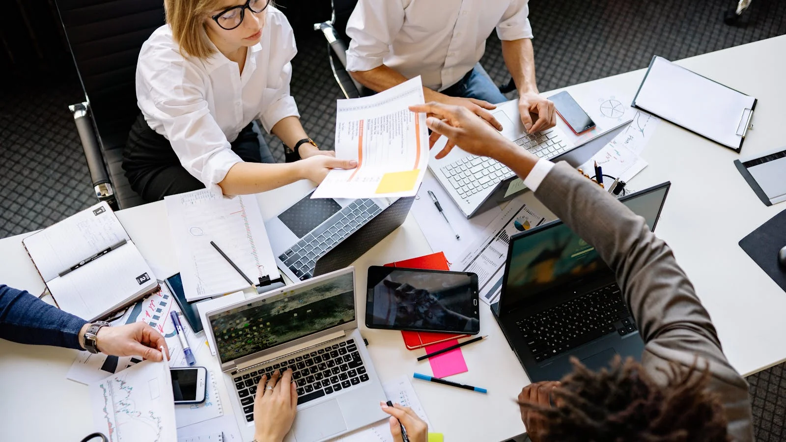A diverse team working together on laptops, the inside-out view that sinks most launch releases