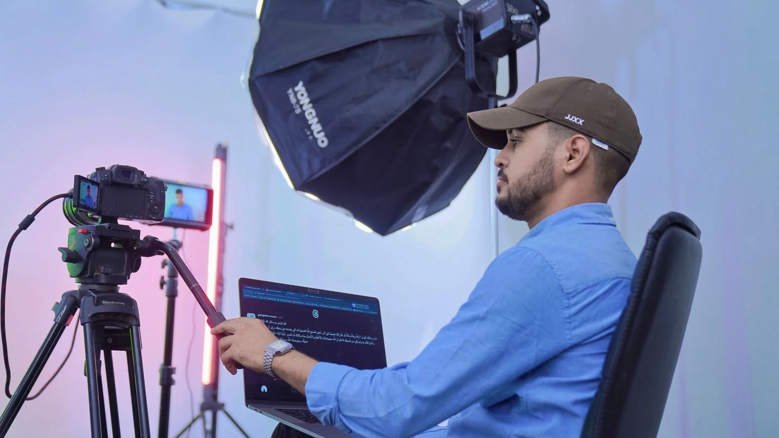 Professional multimedia production setup in a studio with camera and lighting equipment