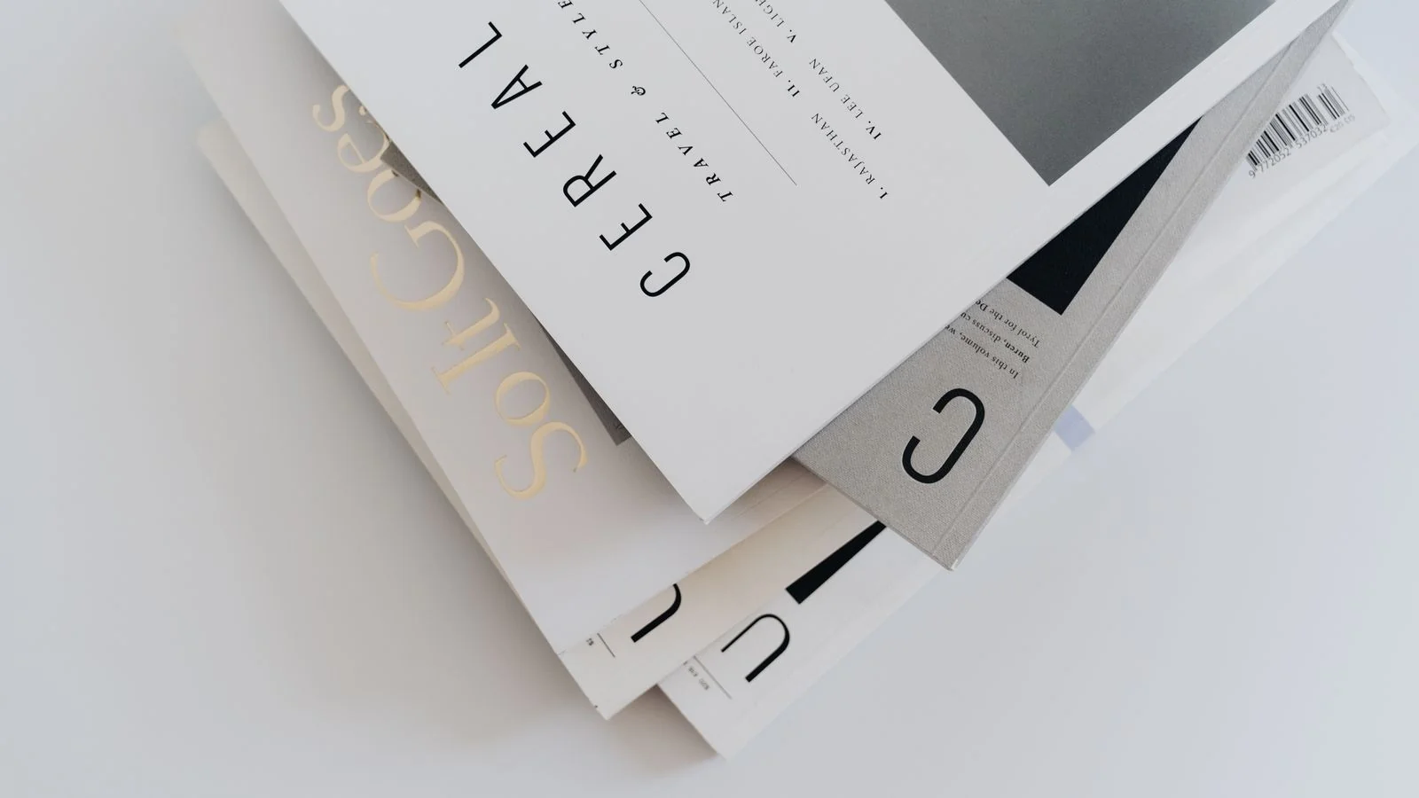 A stack of magazines on a table, the earned output that press releases still feed