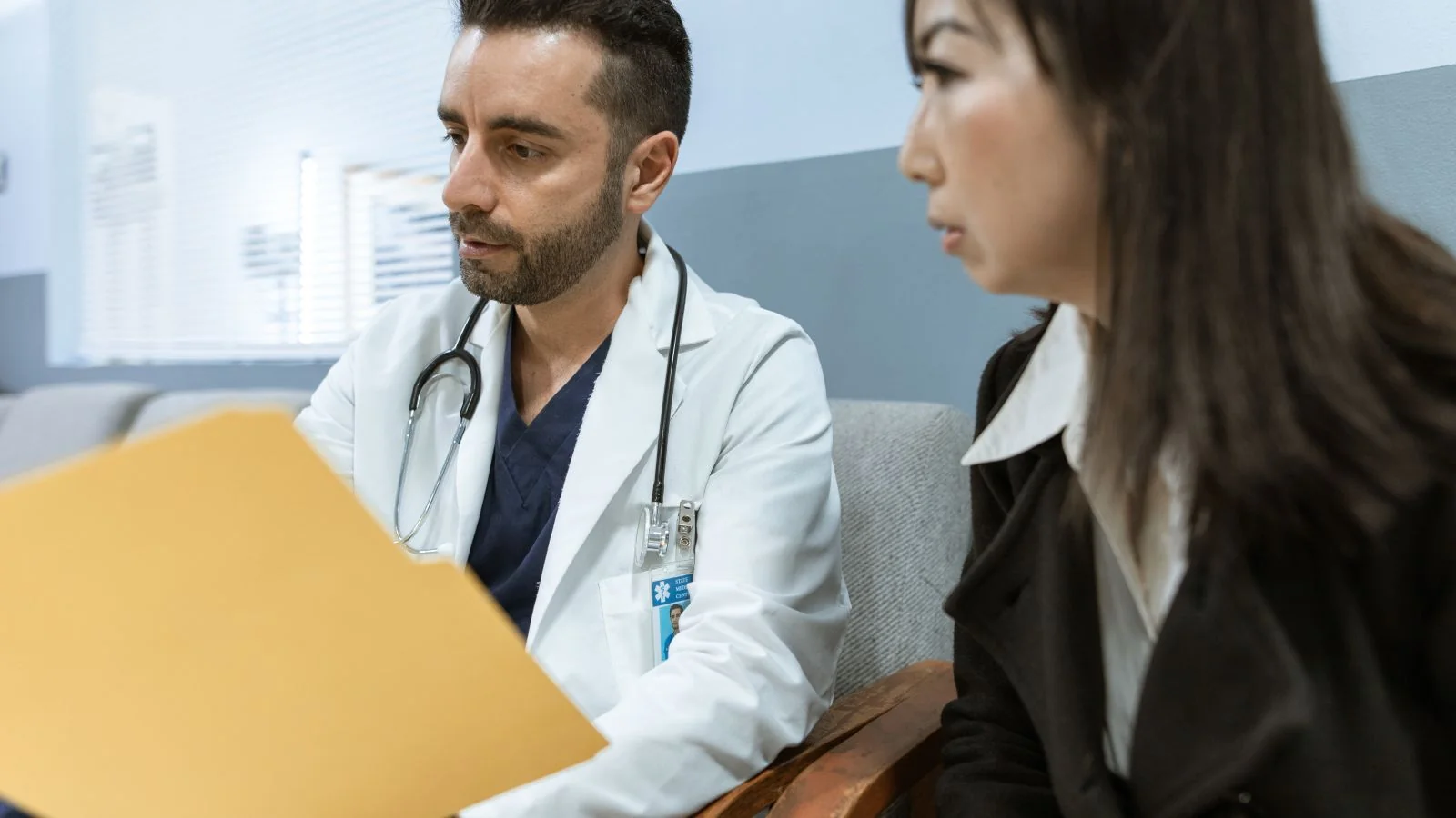 A clinician going through records with a patient, the conversation where the useful review actually gets prompted