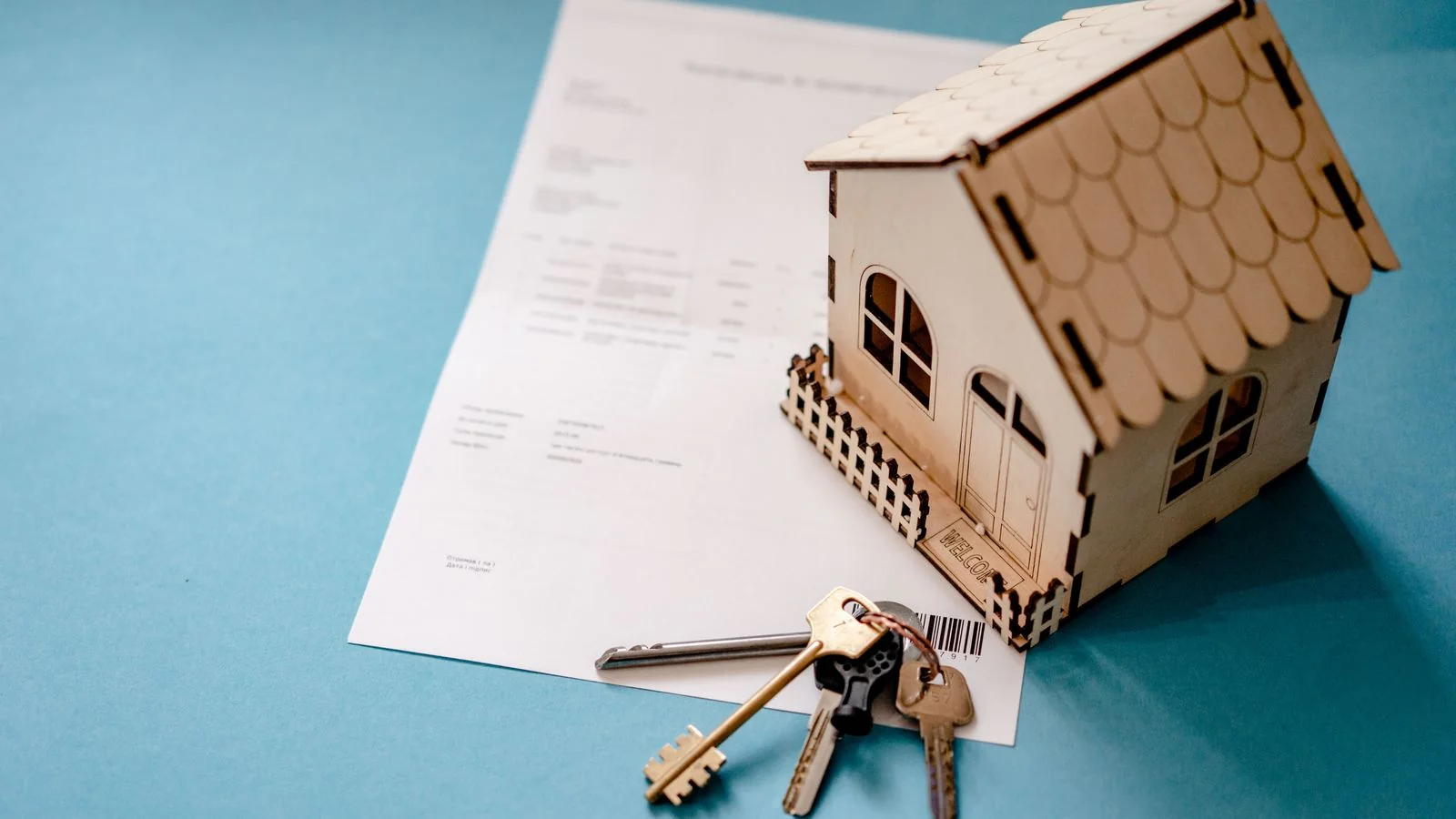 A couple signing mortgage paperwork with a lender.