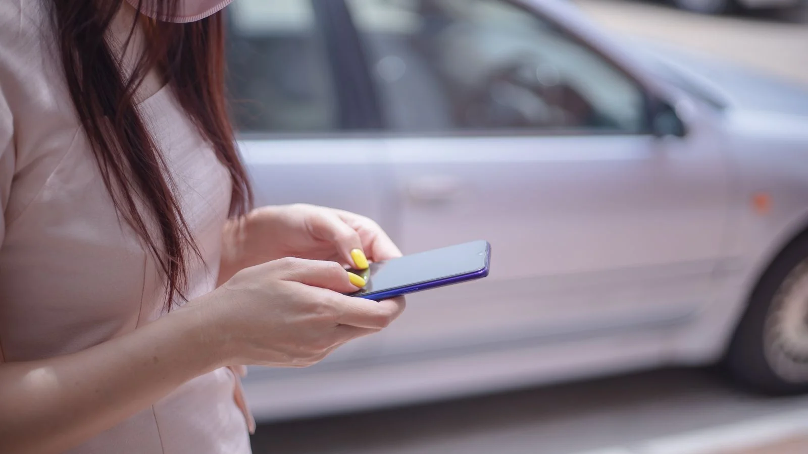 A person reading a message on a smartphone, the moment a candidate checks your reviews.