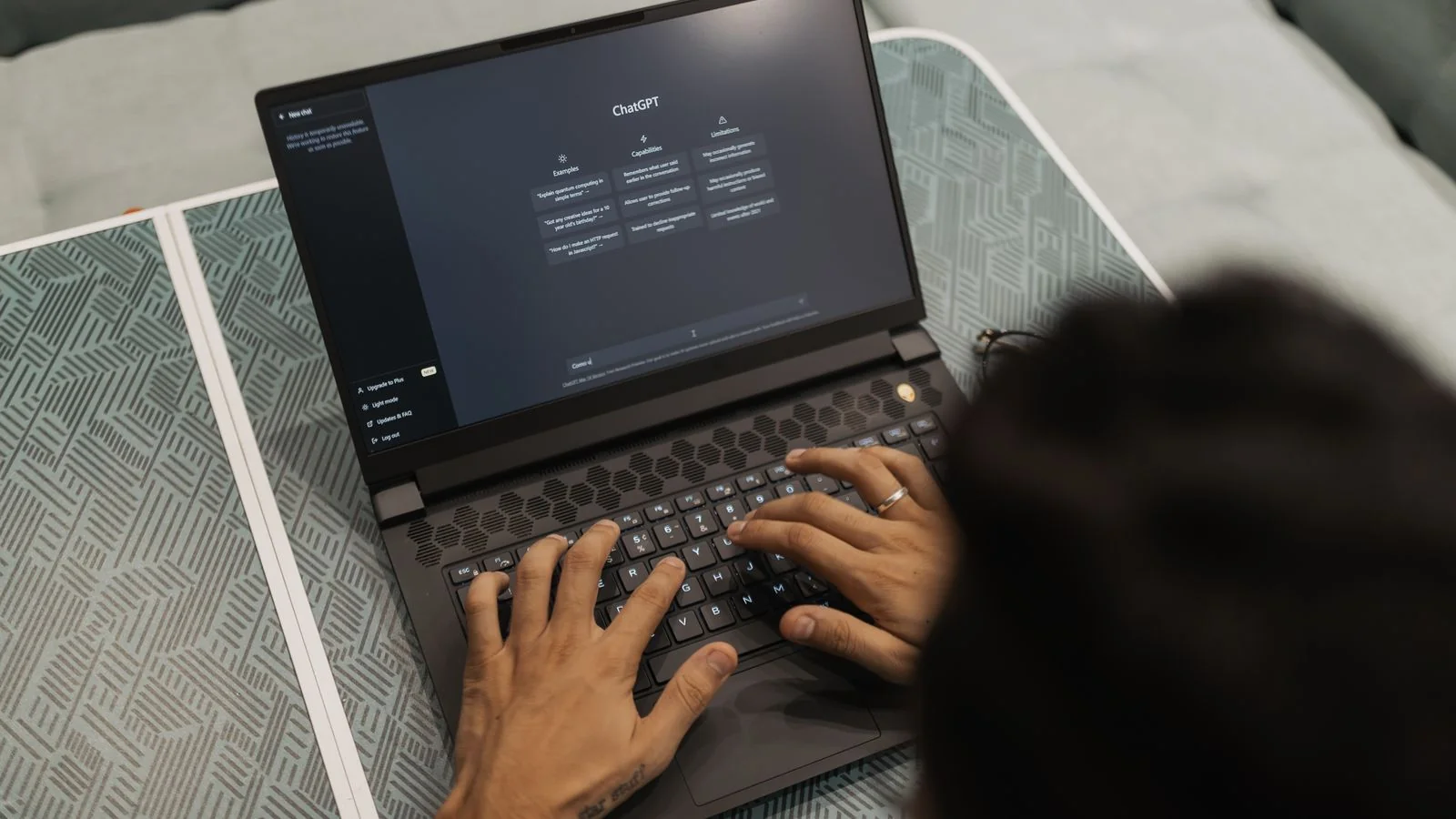 Customer leaving a five-star review on a laptop