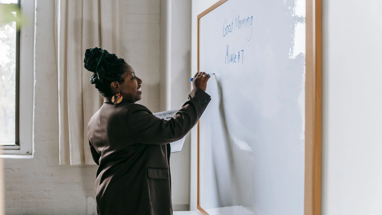 A classroom whiteboard covered in worked equations