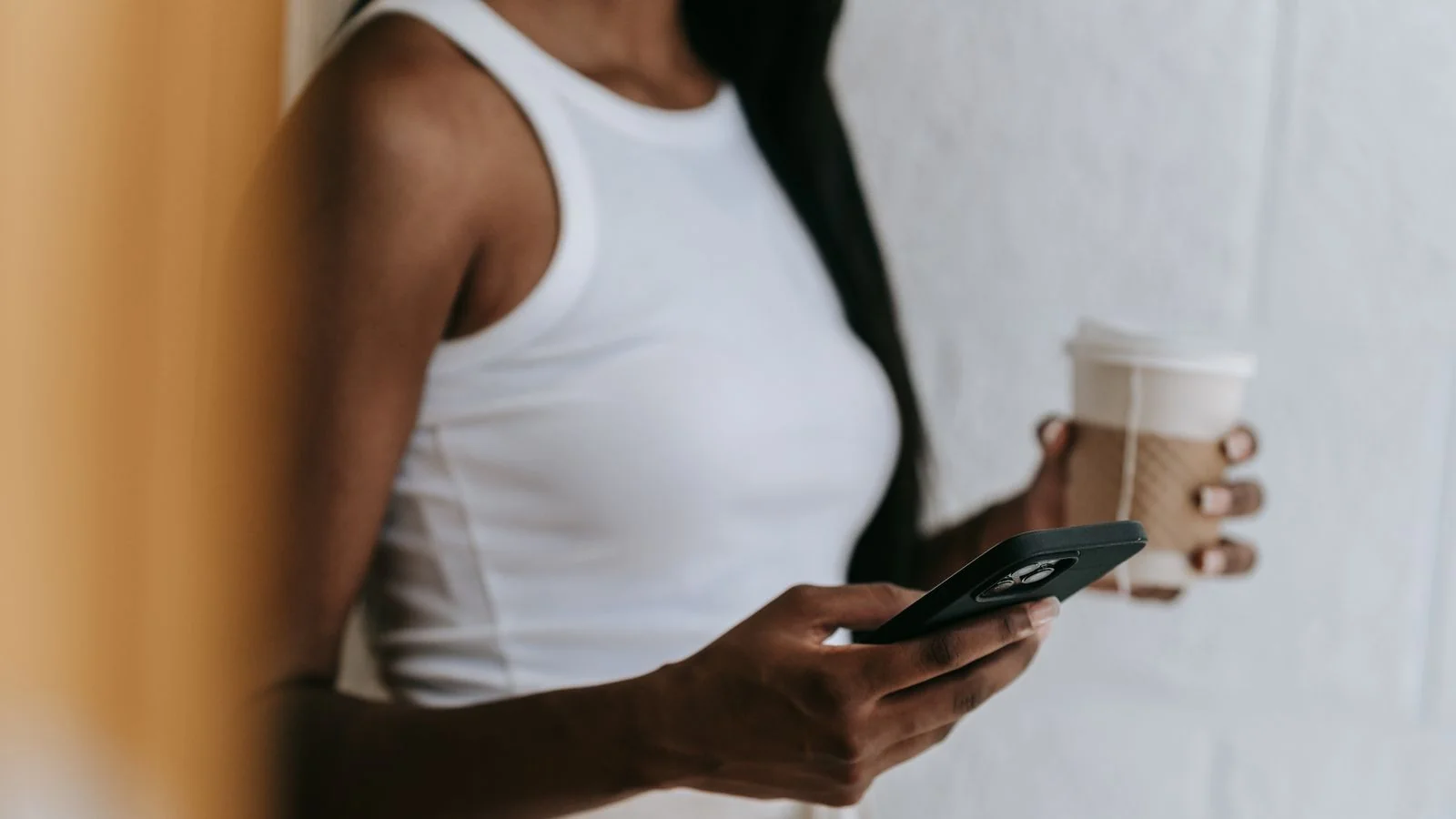 A customer checking an online review on a phone.