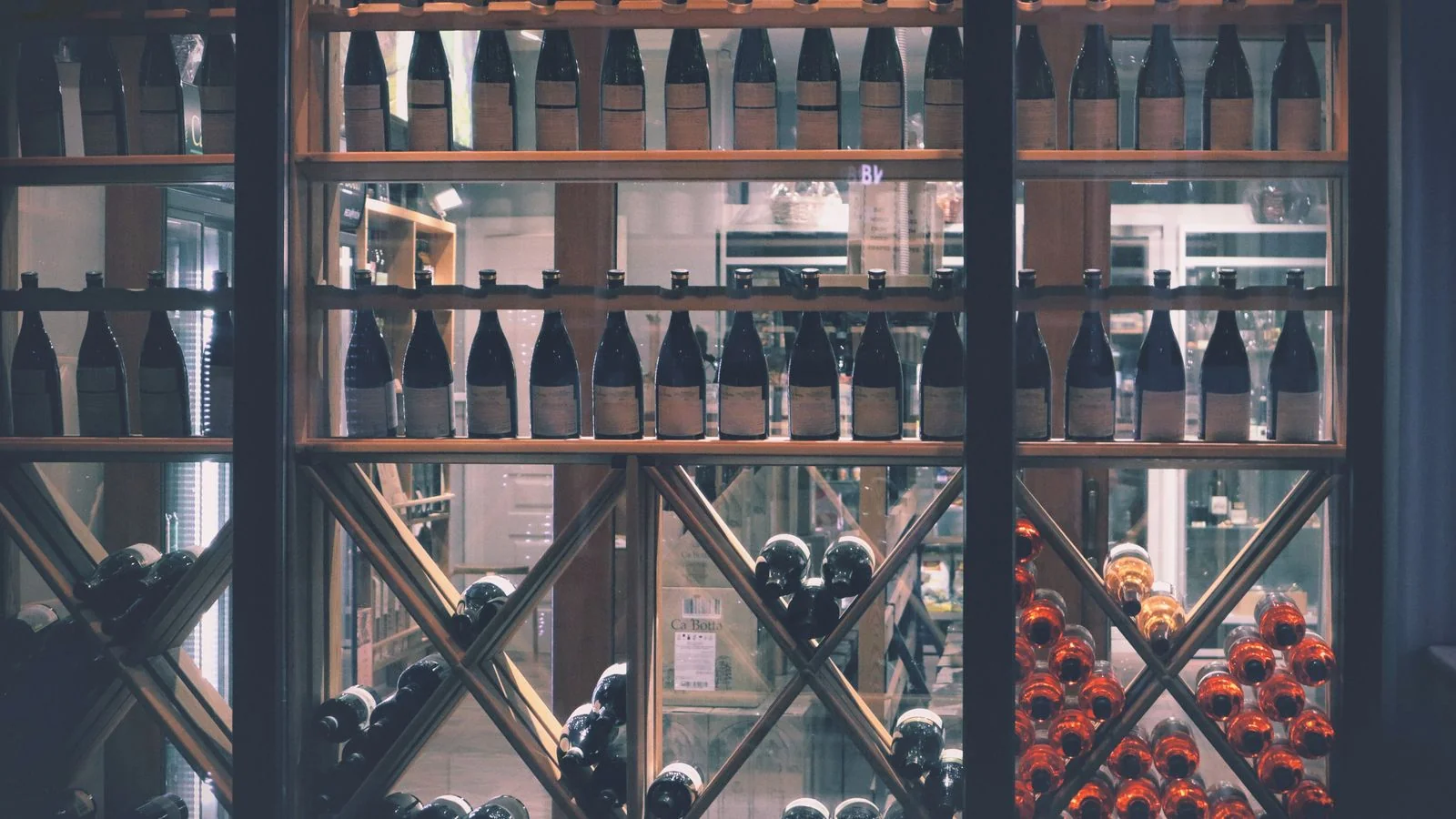 Wine bottles displayed on a retail shelf.