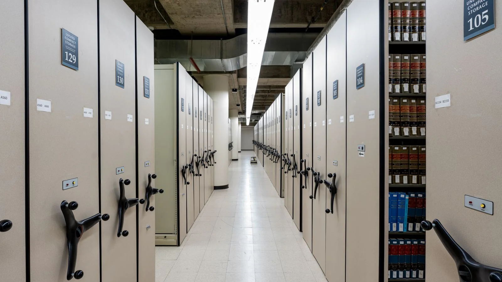 A spacious library archive with compact shelving, the store RAG searches before it generates