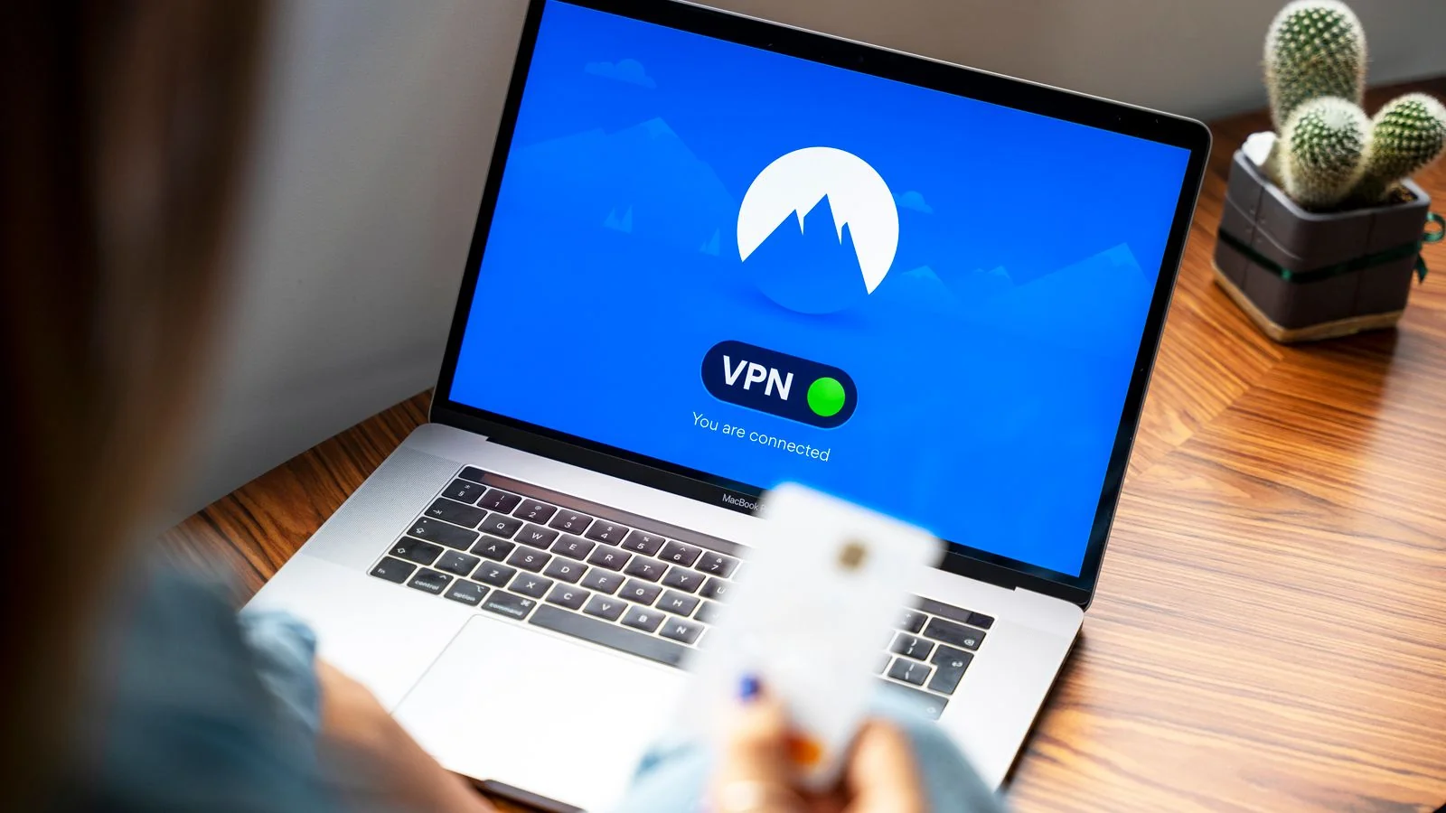 A person using a laptop with a VPN security icon on screen, the data-protection framework behind the right to be forgotten
