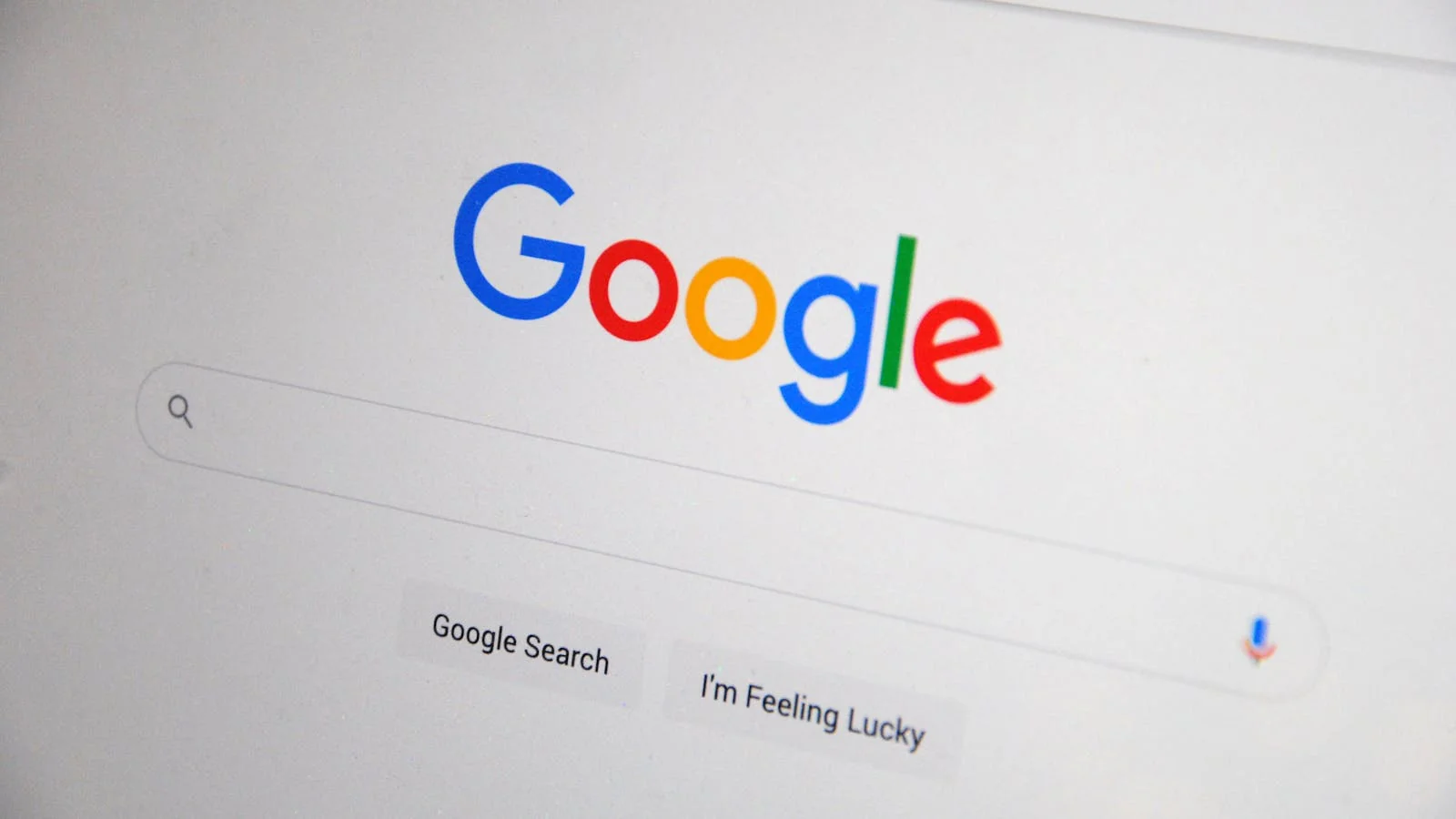 A close-up of the Google homepage on a laptop screen, the surface where every search-removal battle is ultimately fought and measured