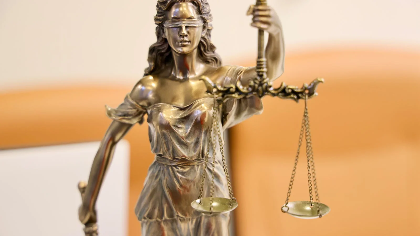 A statue of Lady Justice holding scales, the symbol of the legal framework that underwrites every right-to-be-forgotten claim