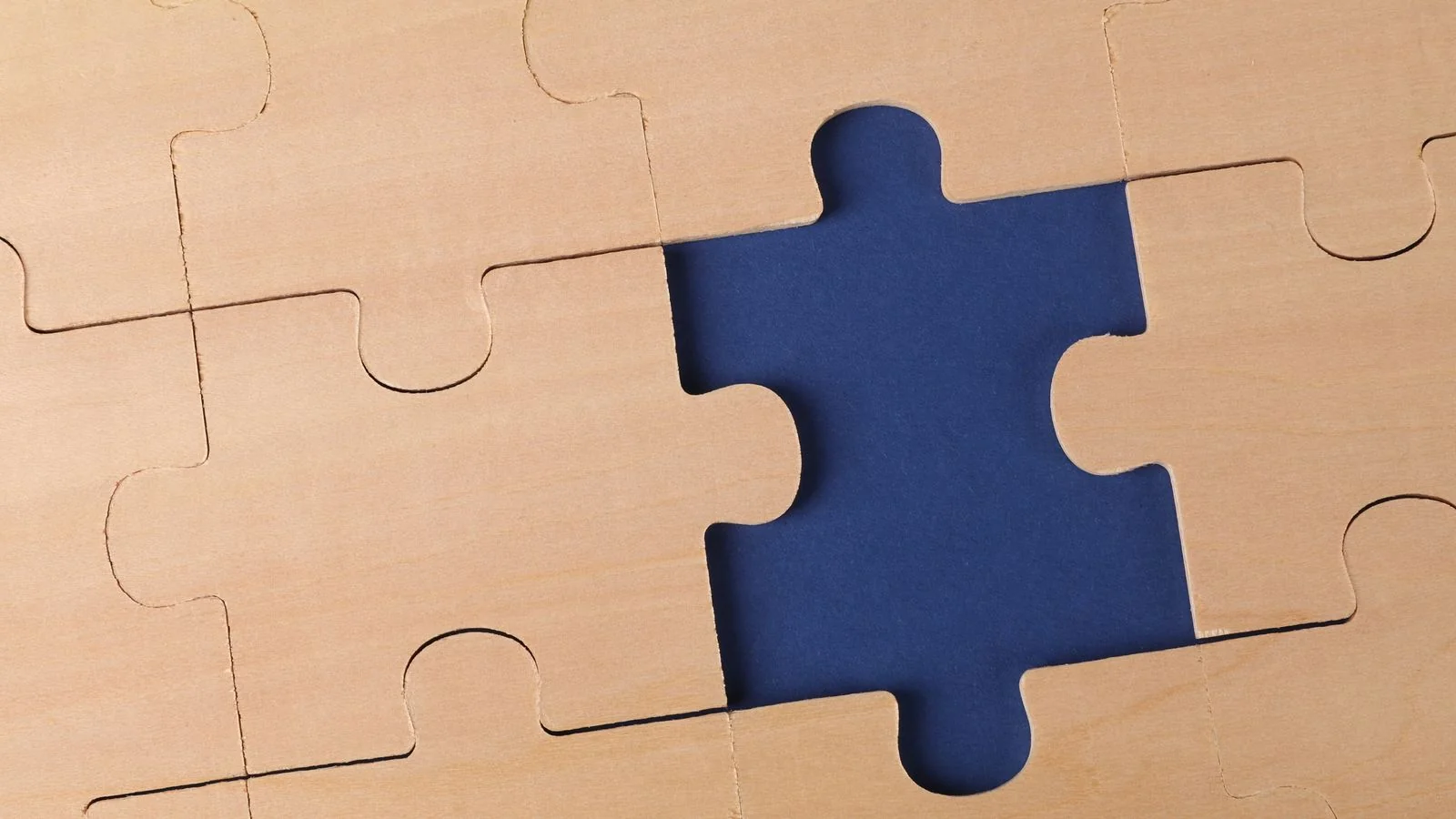 Wooden puzzle with one piece missing, a picture of the gaps in an AI visibility tool