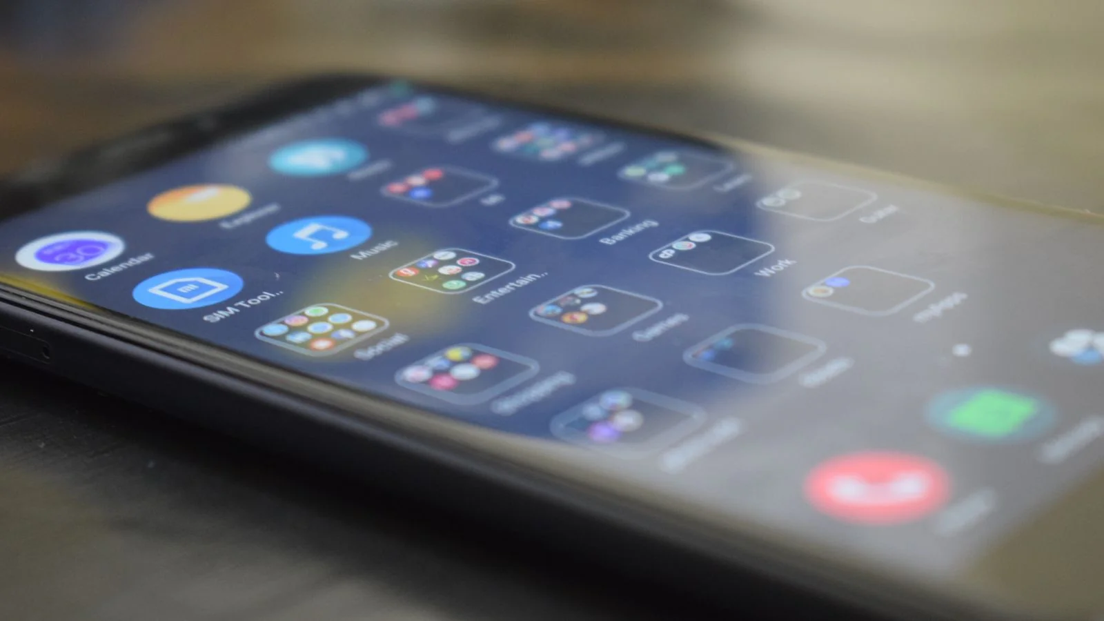 Close-up of a smartphone screen filled with app icons where reviews and mentions accumulate