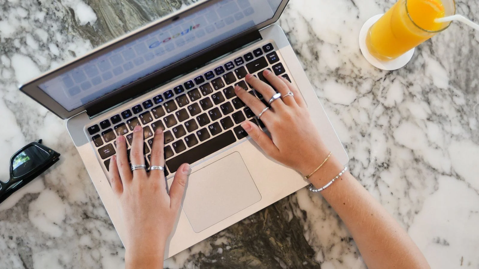 A person reading over coffee at a laptop, the evaluation an engine makes before trusting a source