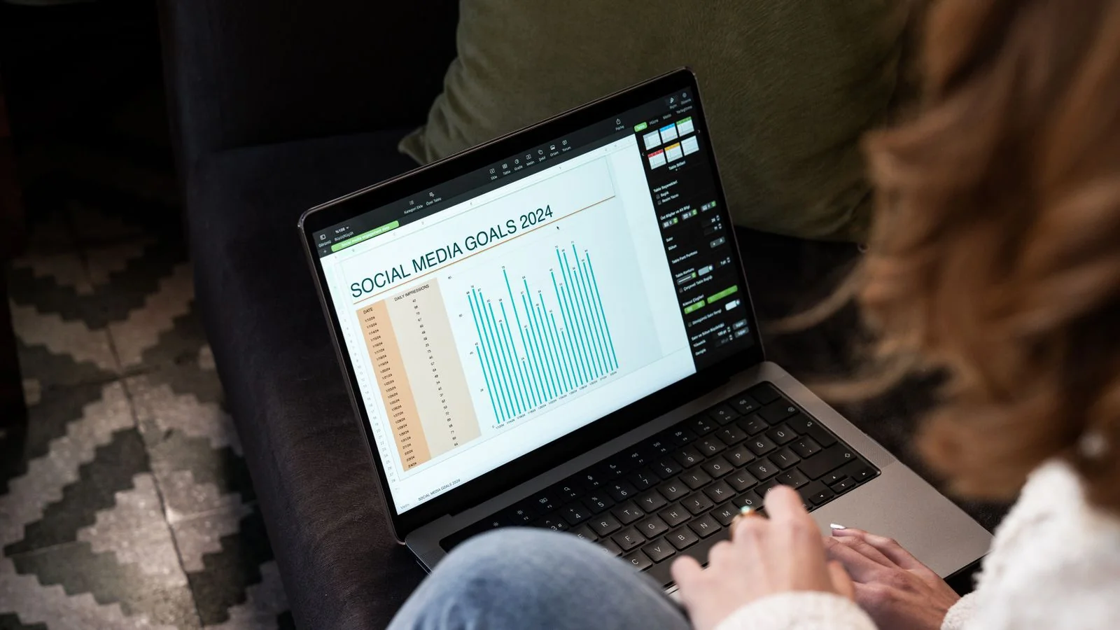 Reviewing a social performance chart on a laptop, the output most teams actually use