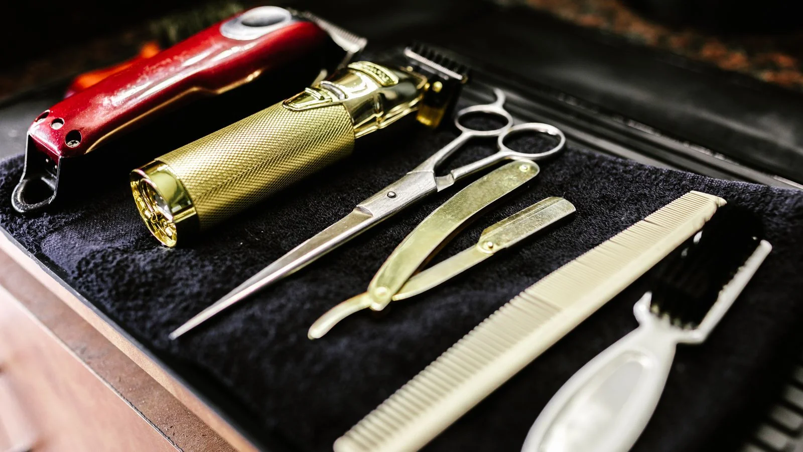 Barbering tools laid out on a bench, the equipment behind a trade that takes years to learn and minutes to dismiss