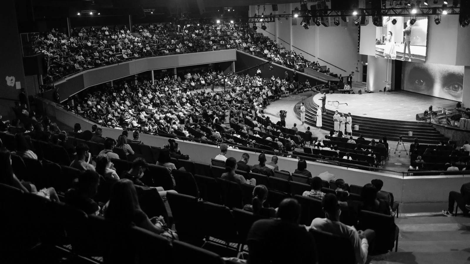 A packed auditorium, the audience a school earns once it says something worth quoting