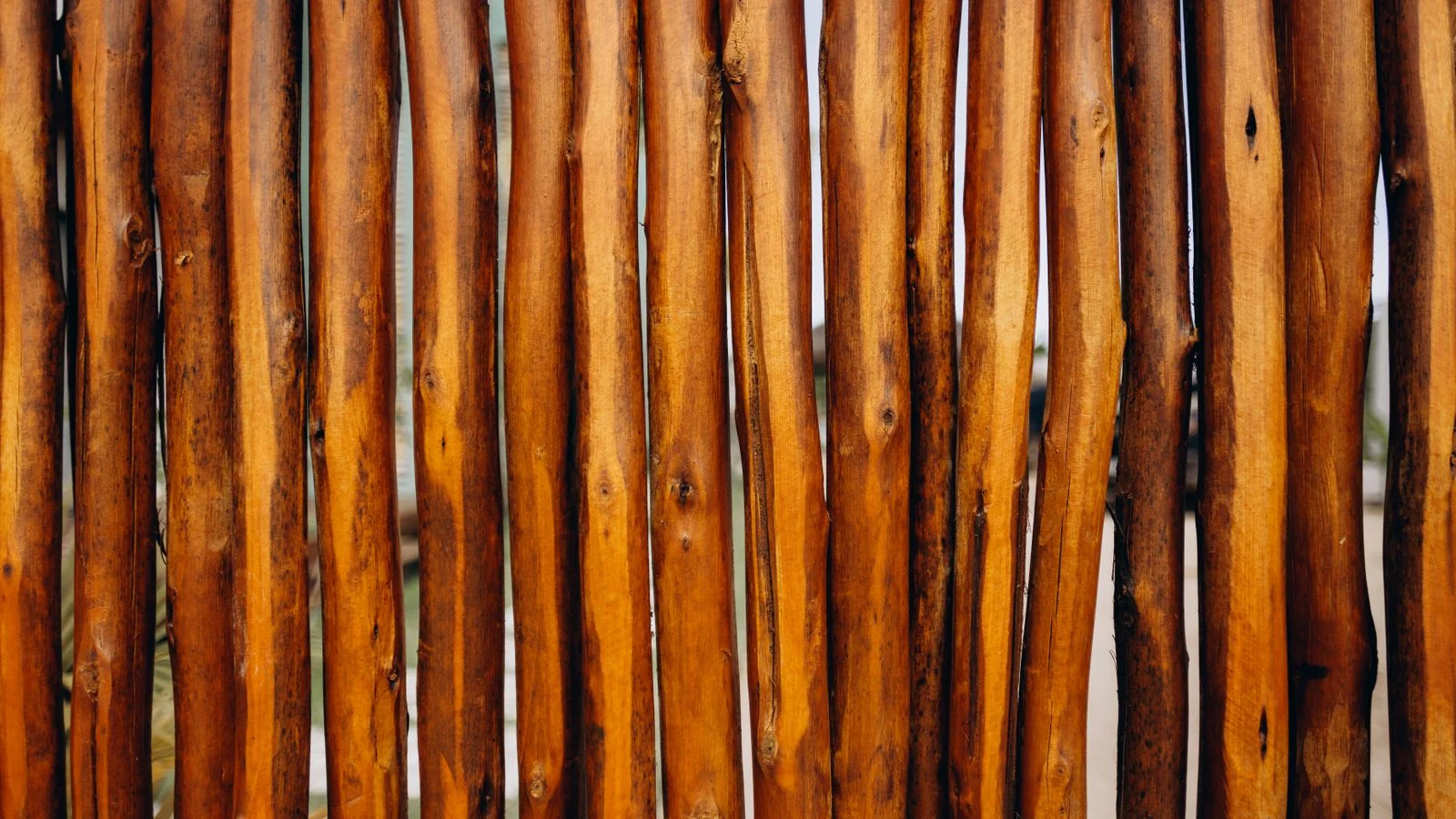 Close-up of a well-built rustic wooden fence showing quality joinery and texture.