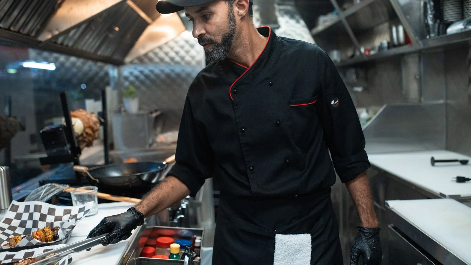 A chef working in a food truck kitchen, where the constraints are tighter than any restaurant line.