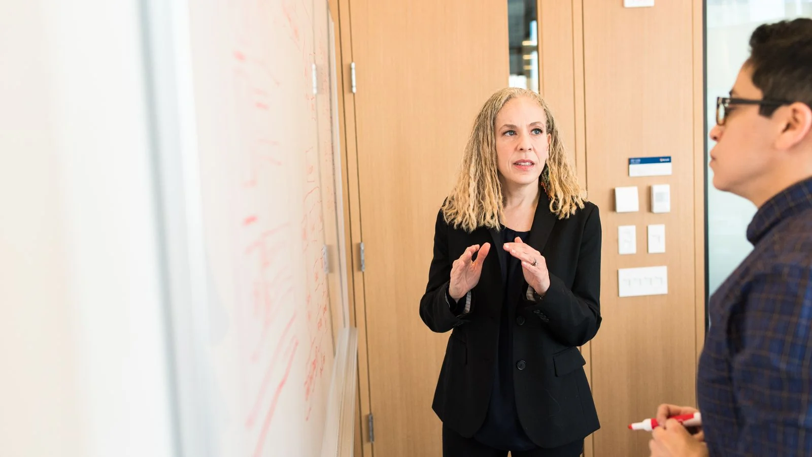 A professional presenting to a small group.
