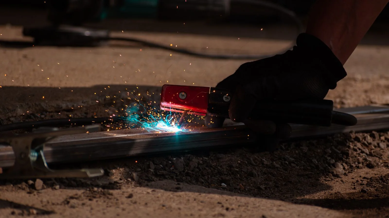 A close-up weld in progress with glowing metal, the expertise a welding shop's authority is built on.
