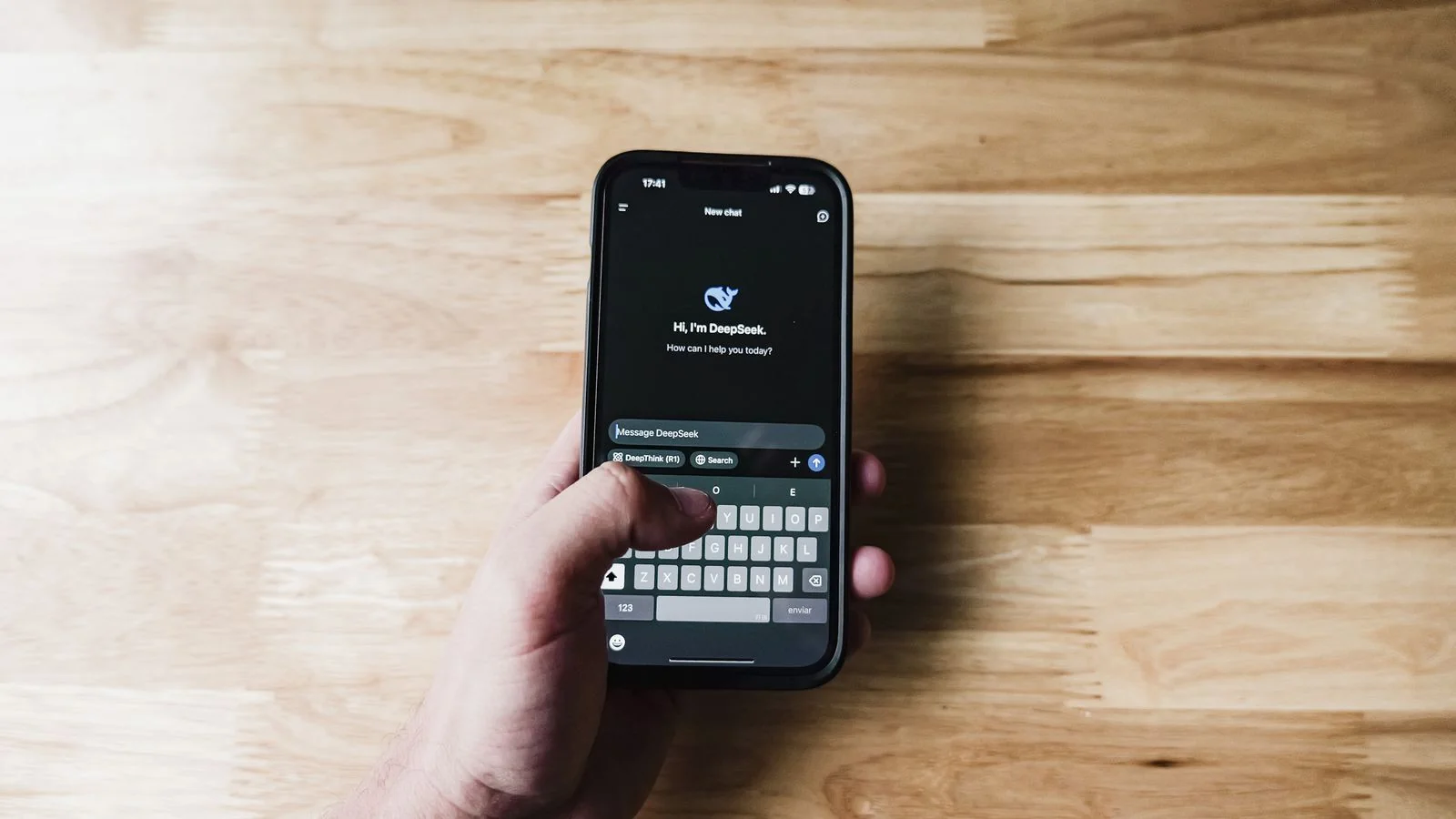 A person holding a smartphone and using an AI assistant to get a direct answer